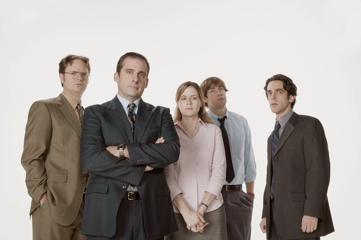 A photo of Rainn Wilson as Dwight Schrute, Steve Carell as Michael Scott, Jenna Fischer as Pam Beesly, John Krasinski as Jim Halpert, and B.J. Novak as Ryan Howard.