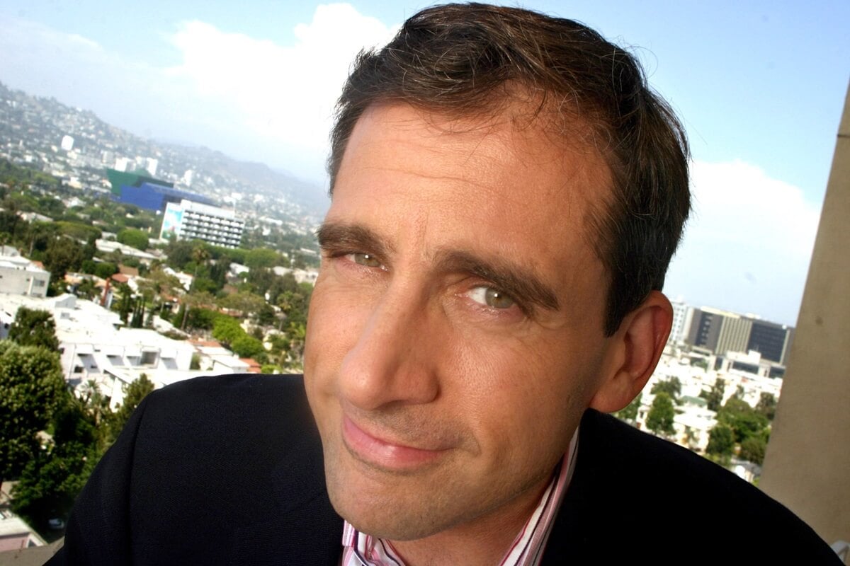 Steve Carell posing for a picture at the Four Season's Hotel in Beverly Hill while wearing a suit.