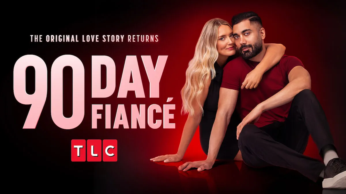 A blonde woman with her arms around a man in key art for Joan leans against Gregory's back against a red background in a promo portrait for '90 Day Fiancé' Season 11