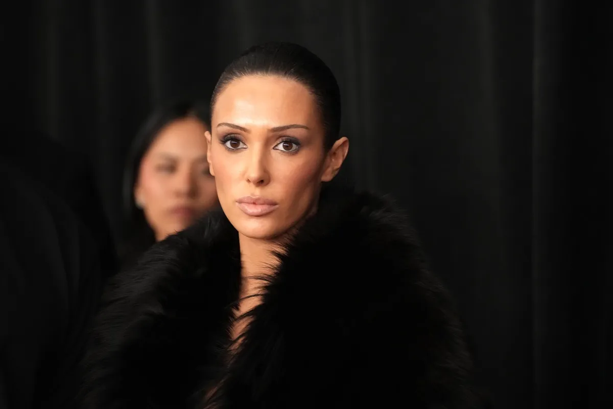 A close-up of Bianca Censori in a black coat at the Grammy Awards