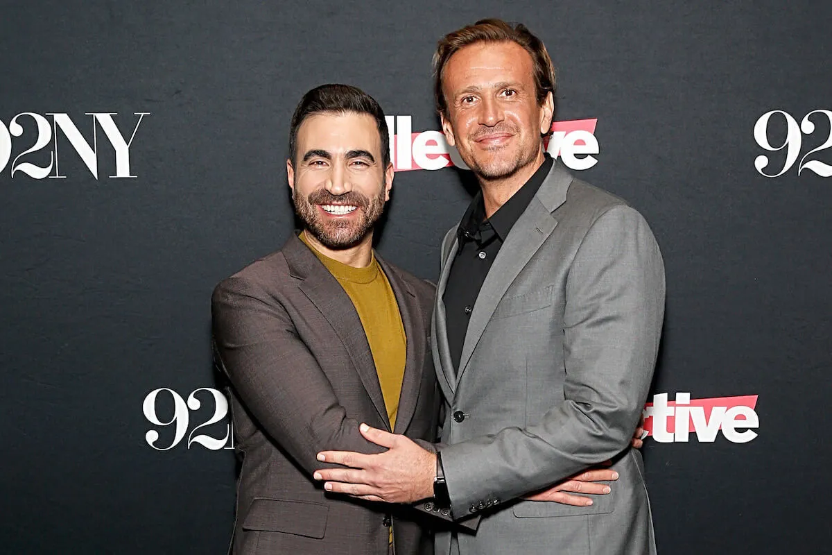 Brett Goldstein and Jason Segel, who couldn't look at Brett Goldstein while filming, pose together.