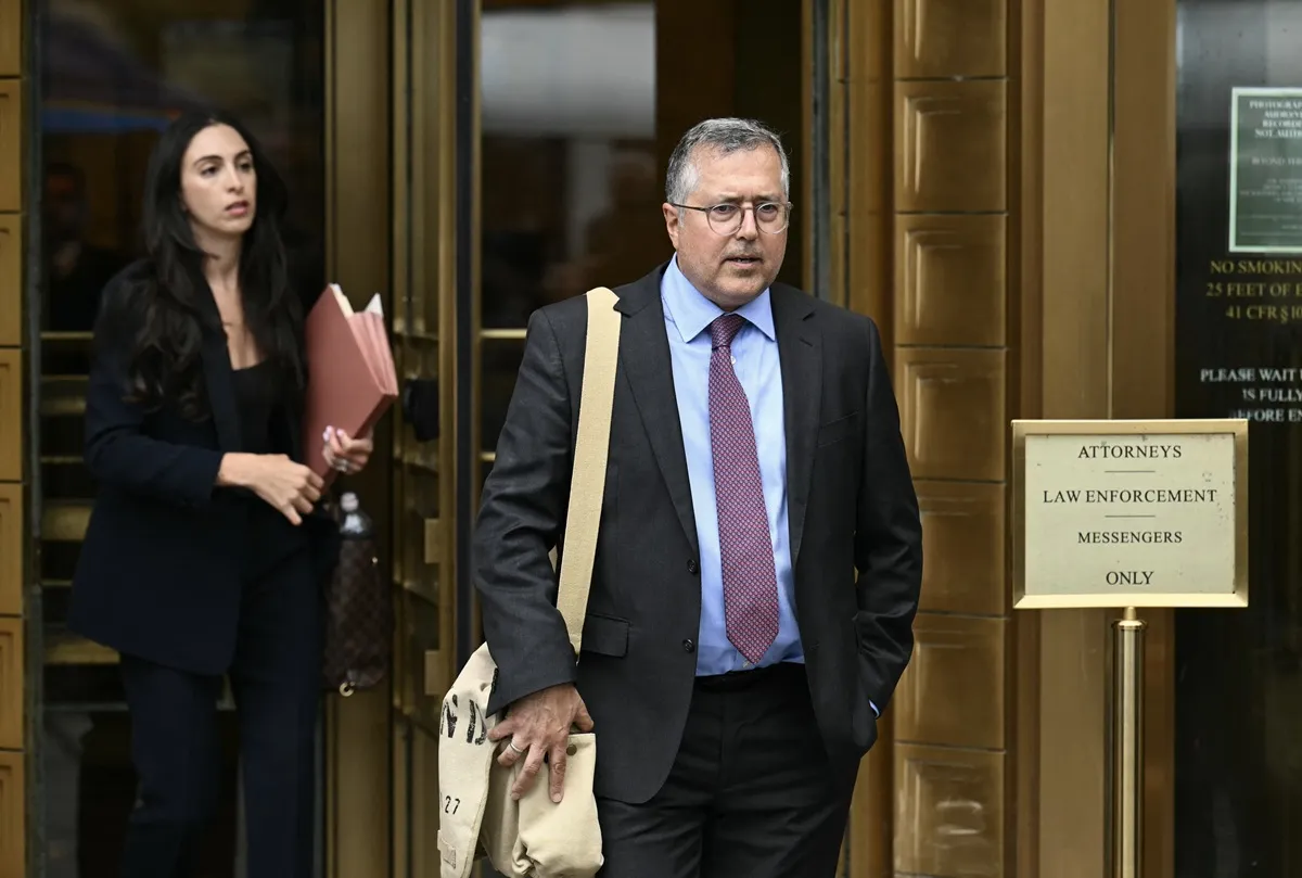 Marc Agnifilo (R) and Teny Geragos (L) leave the courthouse together following a hearing in Sean 'Diddy' Combs' criminal case. 