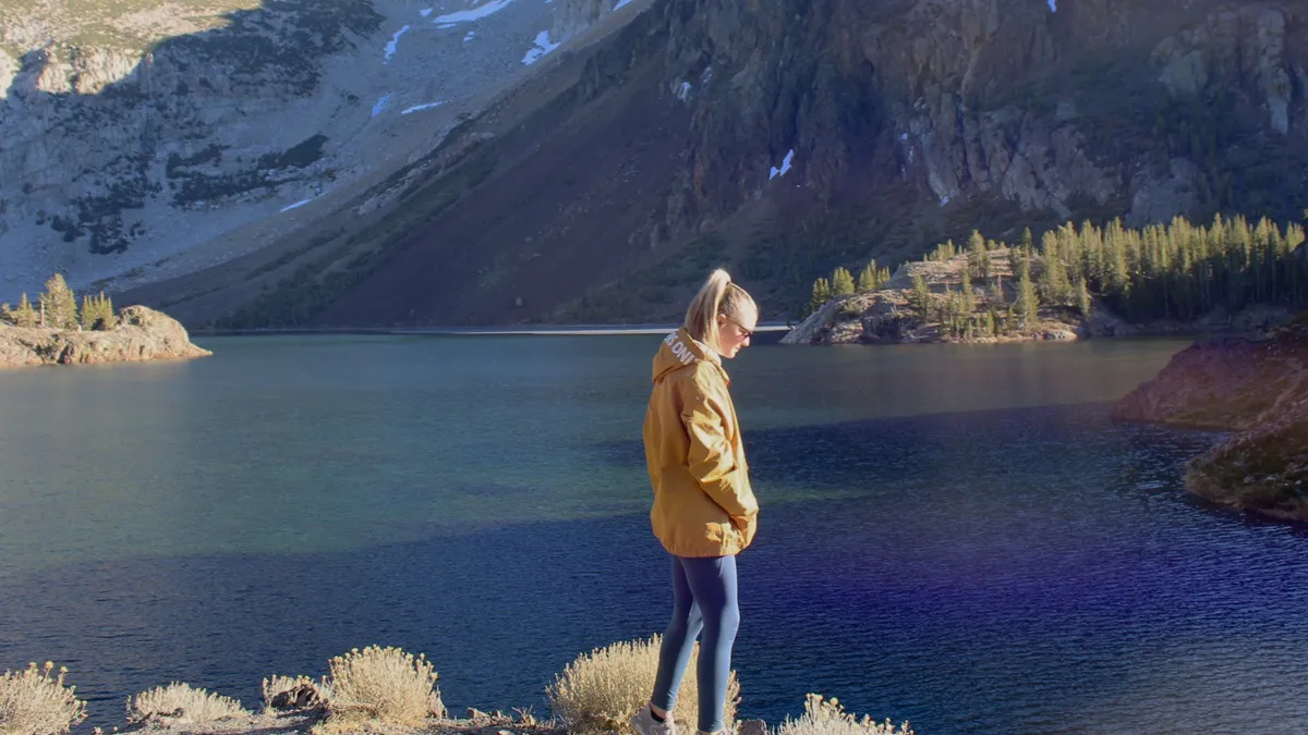 Gabby Petito is seen standing by a river in footage from 'American Murder: Gabby Petito'