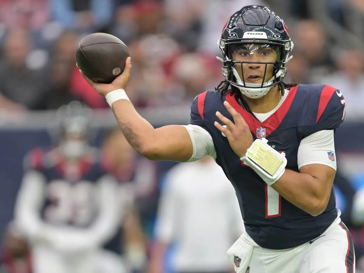 Houston Texans quarterback C.J. Stroud passes the ball down the field during a game at NRG Stadium