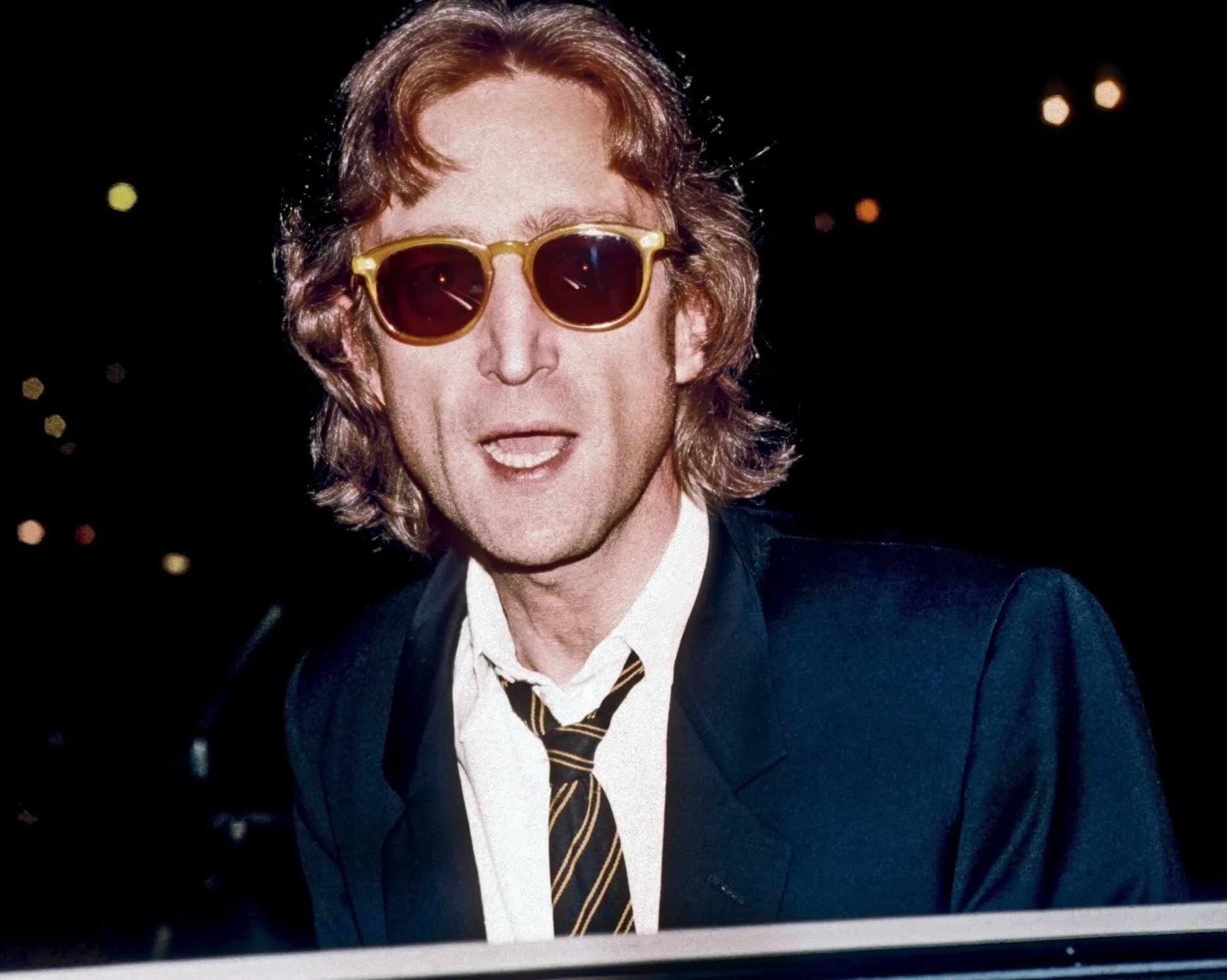 John Lennon in a suit