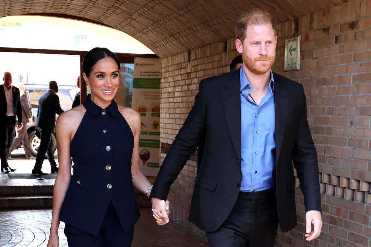 Meghan Markle and Prince Harry, who are reportedly making more joint appearances in 2025, hold hands