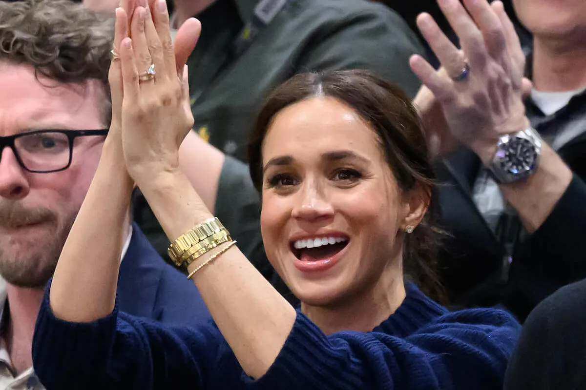 Meghan Markle, who debuted a new bracelet on her bracelet stack at the Invictus Games, claps