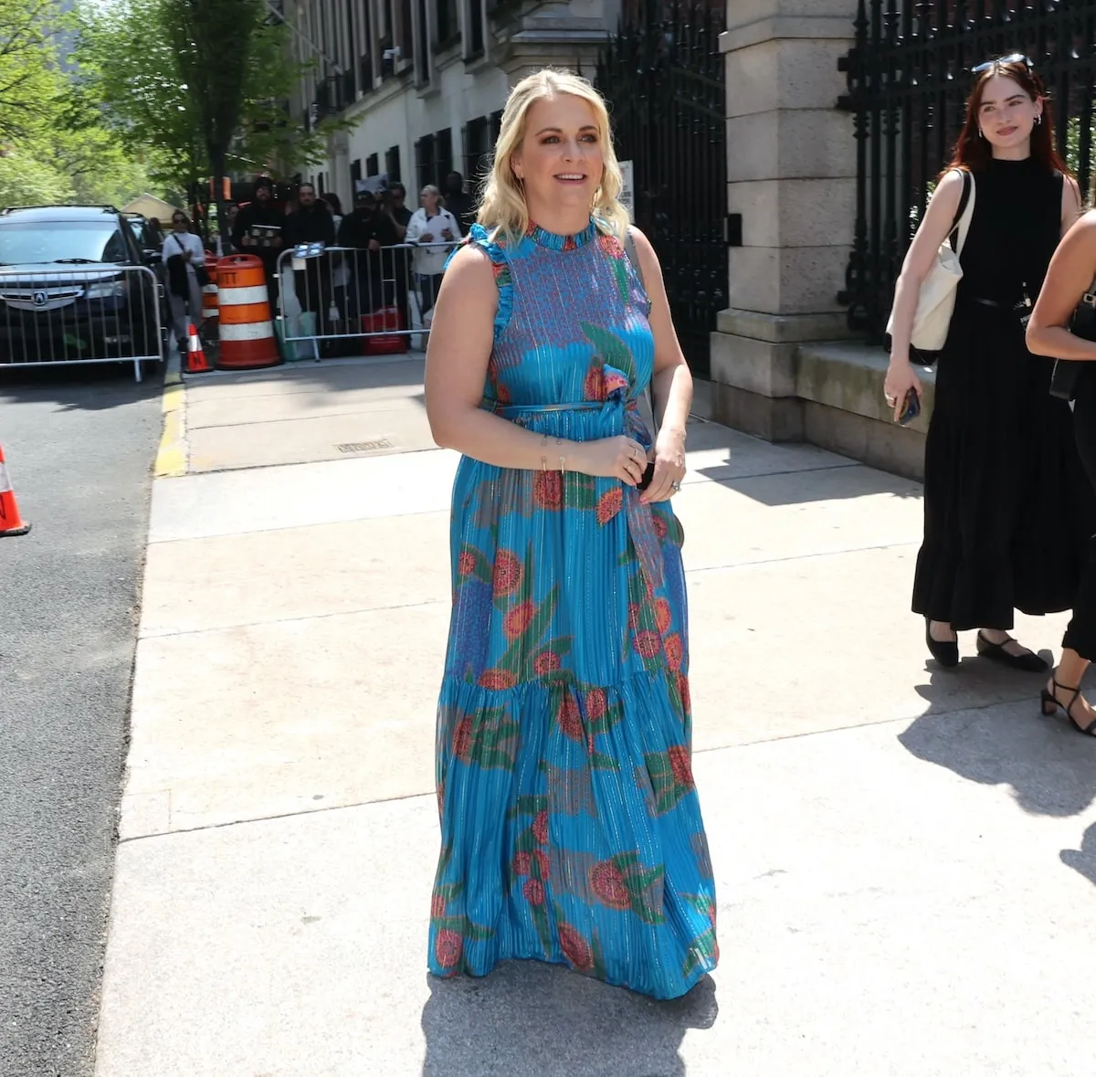 Wearing a blue floral dress, Melissa Joan Hart enters Variety's 2024 Power of Women in Uptown, Manhattan