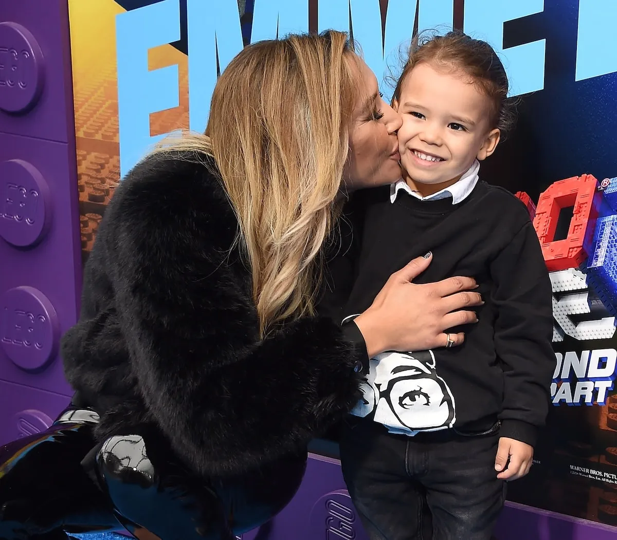 Actor Naya Rivera kisses her son, Josey, on the cheek at a movie premiere in 2019