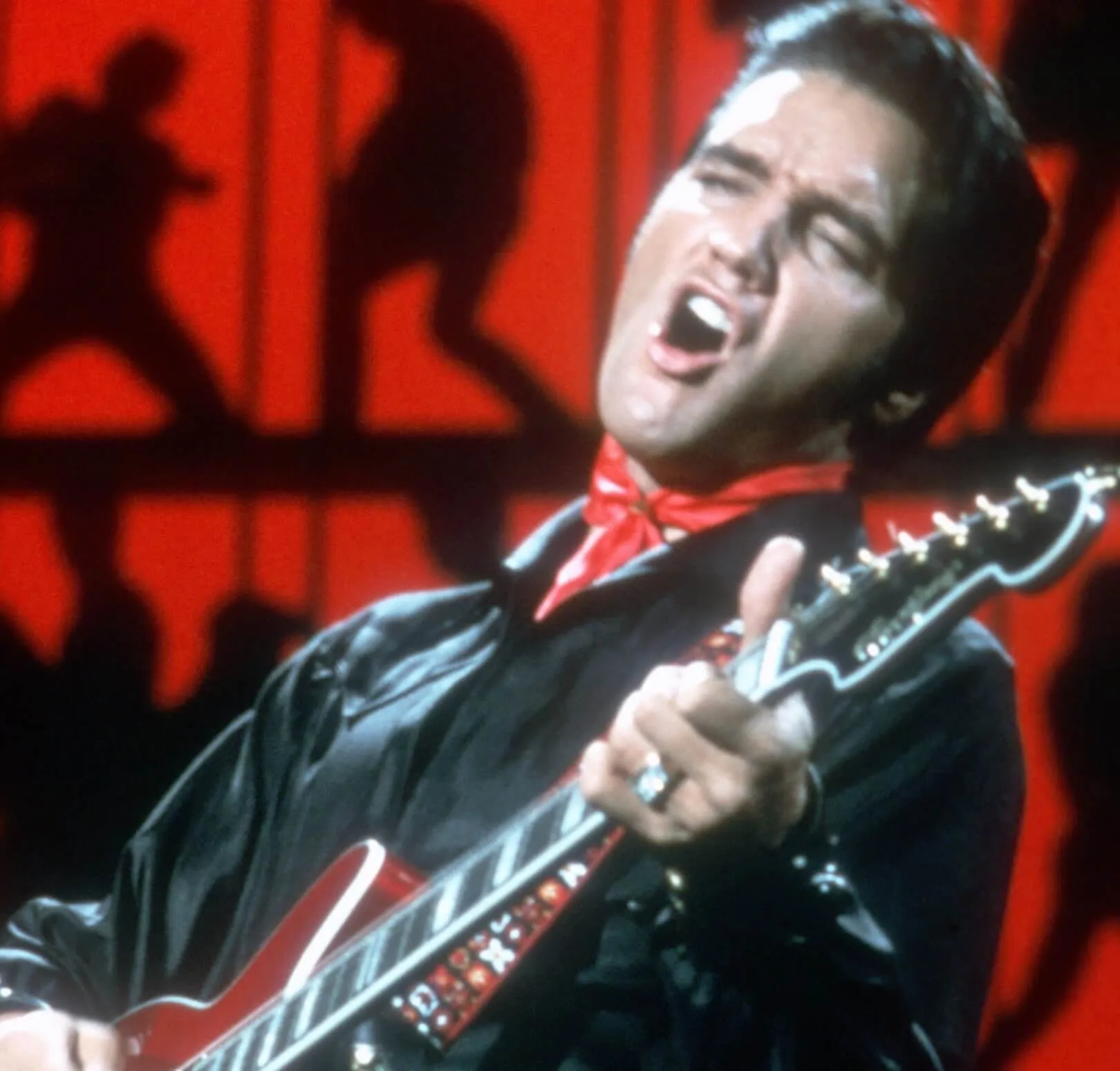 Elvis Presley with a guitar at the '68 Comeback Special'