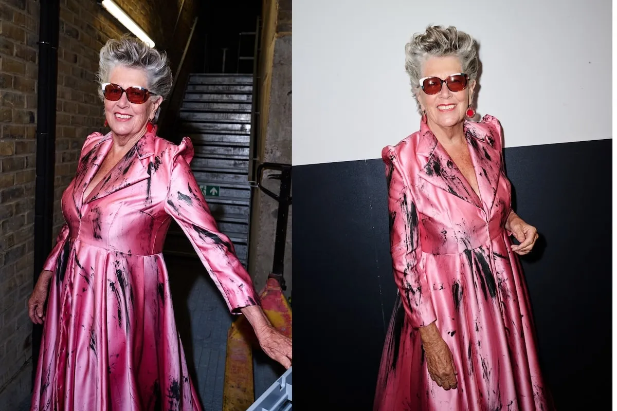 Wearing a pink satin dress, Prue Leith smiles backstage before the VIN + OMI London Fashion Week show