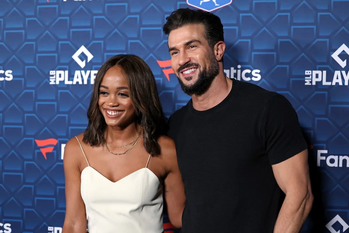 Smiling together on the red carpet, Rachel Lindsay and Bryan Abasolo attend a Fanatics media event in 2022