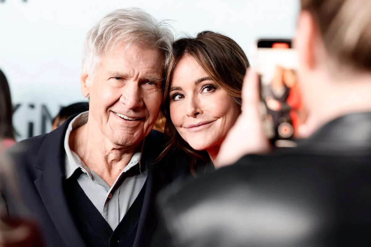 'Shrinking' stars Harrison Ford and Christa Miller pose for a selfie.