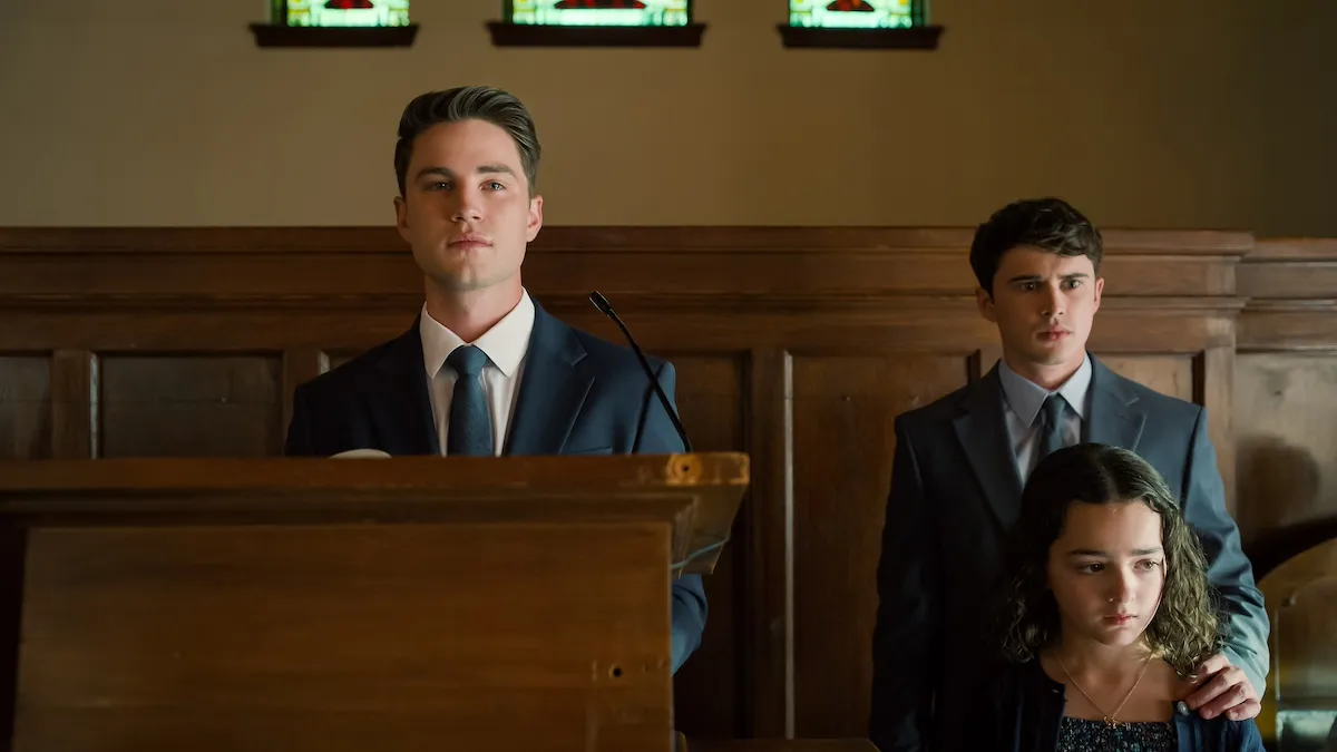 Ty speaking at Bill's funeral with Kyle and Katie standing behind him in 'Sweet Magnolias' Season 4